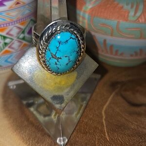 Sterling Silver Ring with a Turquoise Cabochon.